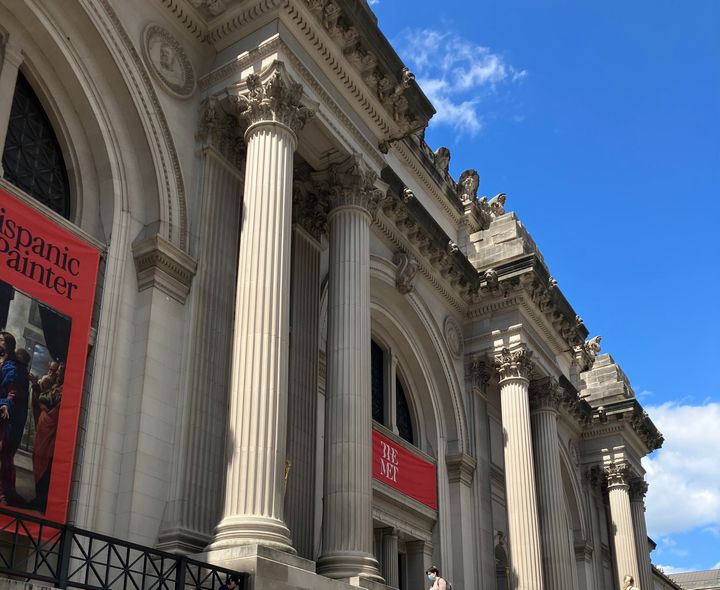 A classical building with large columns.