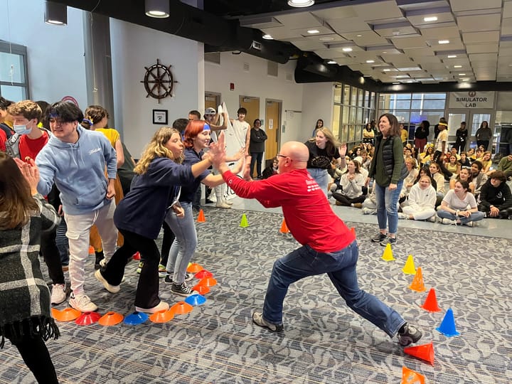 Students and teachers high-five to escape "Shark Island."